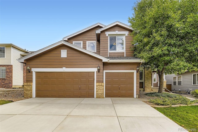 9975 Blackbird Cir, Highlands Ranch, CO 80130 - view of front of property with concrete driveway and an attached garage