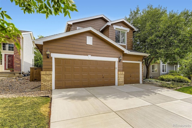 9975 Blackbird Cir, Highlands Ranch, CO 80130 - traditional-style house featuring driveway and brick siding