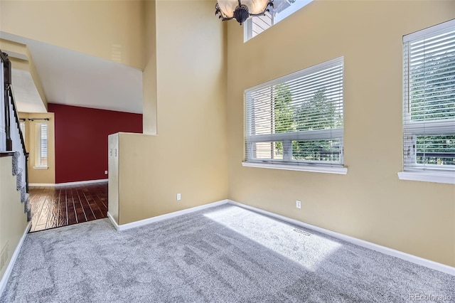 9975 Blackbird Cir, Highlands Ranch, CO 80130 - carpeted spare room with healthy amount of natural light and a chandelier