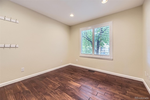 9975 Blackbird Cir, Highlands Ranch, CO 80130 - empty room with dark wood-type flooring and recessed lighting