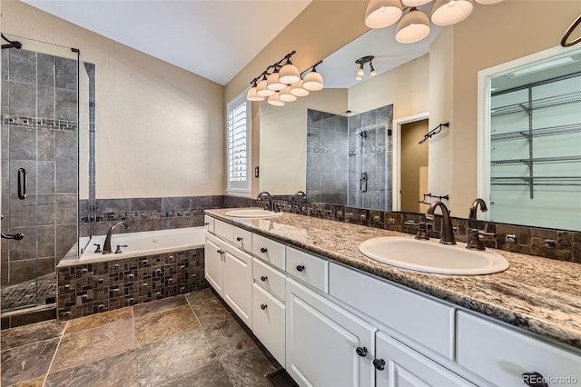 9975 Blackbird Cir, Highlands Ranch, CO 80130 - full bath featuring a shower stall, double vanity, a garden tub, and stone finish flooring