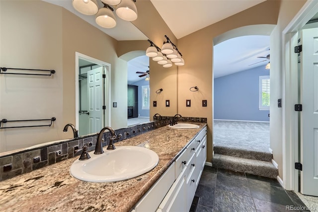 9975 Blackbird Cir, Highlands Ranch, CO 80130 - bathroom with ceiling fan, double vanity, and stone finish flooring