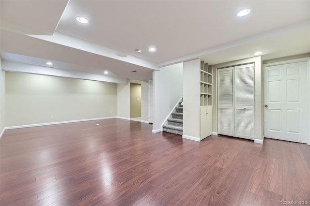 9975 Blackbird Cir, Highlands Ranch, CO 80130 - finished basement with stairs, dark wood finished floors, and recessed lighting
