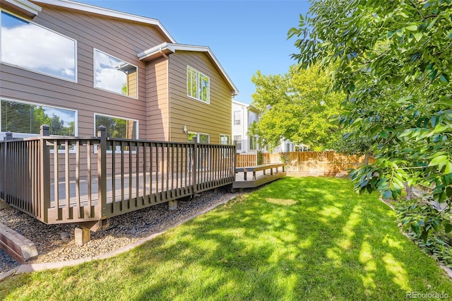 9975 Blackbird Cir, Highlands Ranch, CO 80130 - fenced backyard featuring a wooden deck