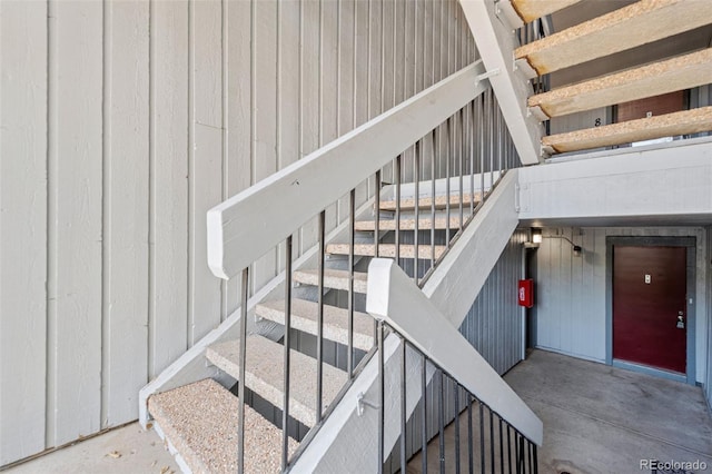 stairway with concrete floors