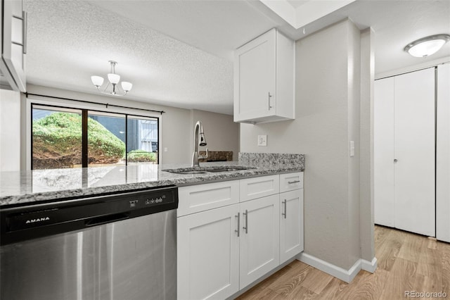 kitchen featuring light hardwood / wood-style floors, white cabinetry, sink, light stone counters, and stainless steel dishwasher