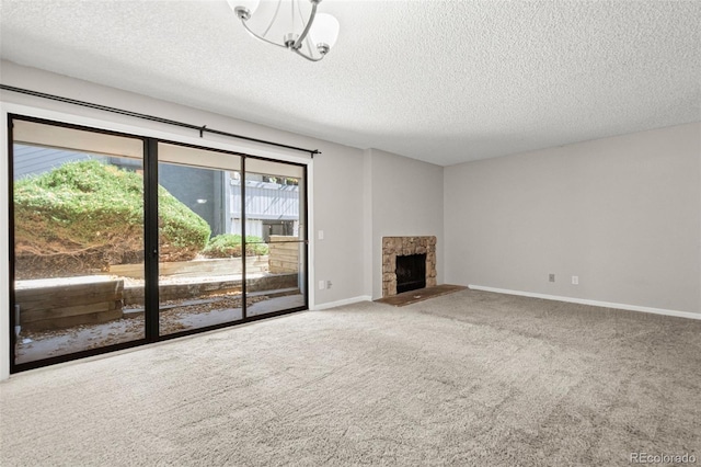 unfurnished living room with a textured ceiling and carpet flooring