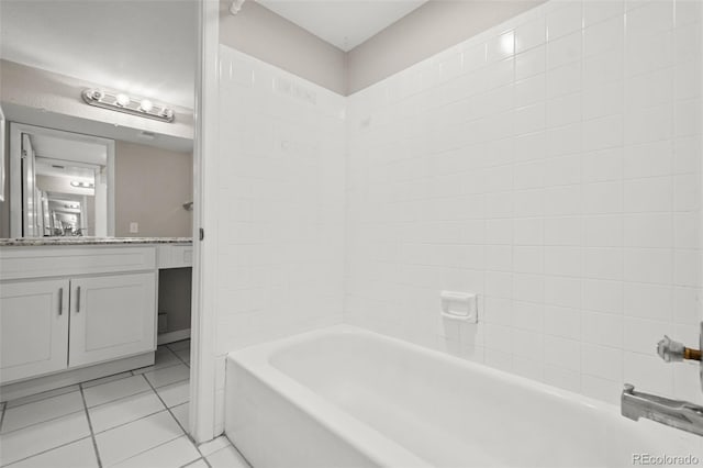 bathroom with shower / bathing tub combination, vanity, and tile patterned floors