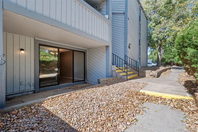 view of side of home featuring a balcony and a patio area