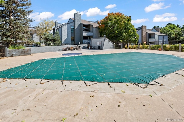 view of swimming pool with a patio area