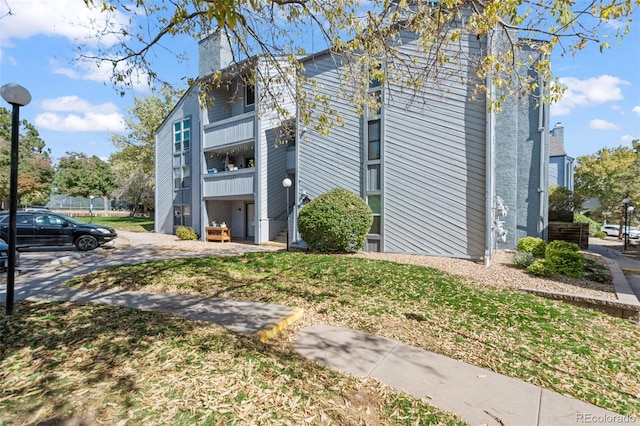 view of property exterior with a balcony