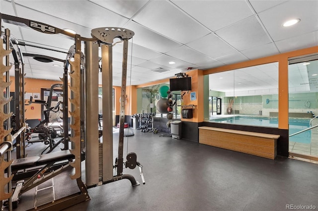 workout area featuring a paneled ceiling