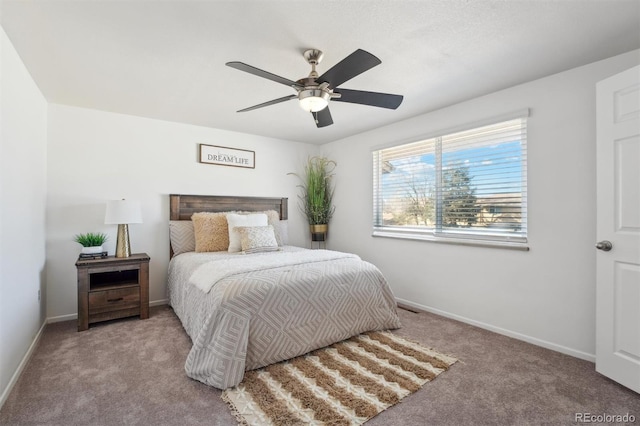 bedroom featuring baseboards, a ceiling fan, and light colored carpet