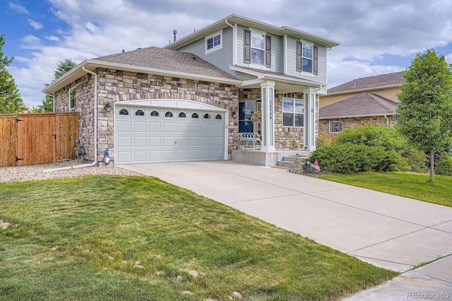 24748 E Layton Pl, Aurora, CO 80016 - traditional-style home with concrete driveway, stone siding, and an attached garage