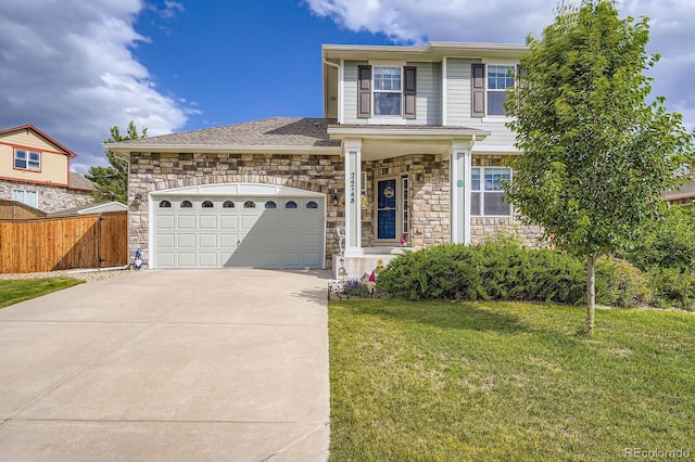 24748 E Layton Pl, Aurora, CO 80016 - traditional-style home with stone siding, an attached garage, and driveway