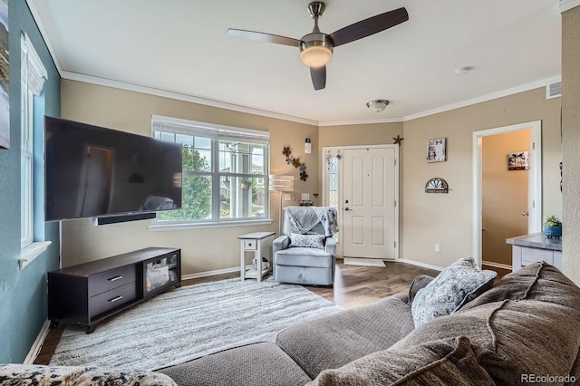 24748 E Layton Pl, Aurora, CO 80016 - living room featuring crown molding, wood finished floors, and a ceiling fan