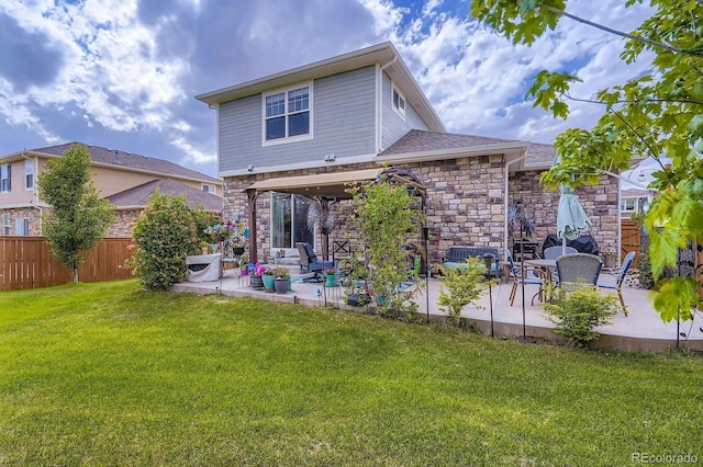 24748 E Layton Pl, Aurora, CO 80016 - back of property featuring a patio area and stone siding