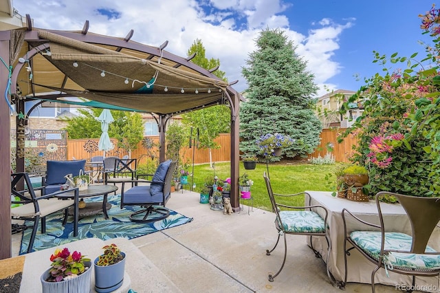 24748 E Layton Pl, Aurora, CO 80016 - fenced backyard with a patio, outdoor dining area, and an outdoor living space