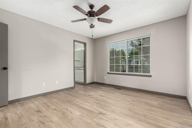 10172 Woodrose Ln, Highlands Ranch, CO 80129 - empty room featuring wood finished floors, a ceiling fan, and a textured ceiling