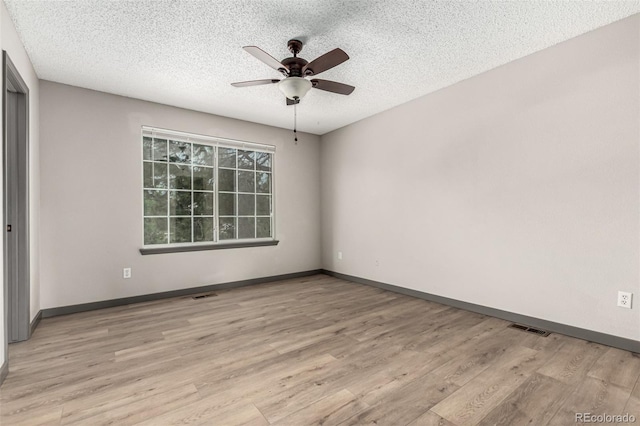 10172 Woodrose Ln, Highlands Ranch, CO 80129 - unfurnished room with a ceiling fan, a textured ceiling, and light wood-style floors