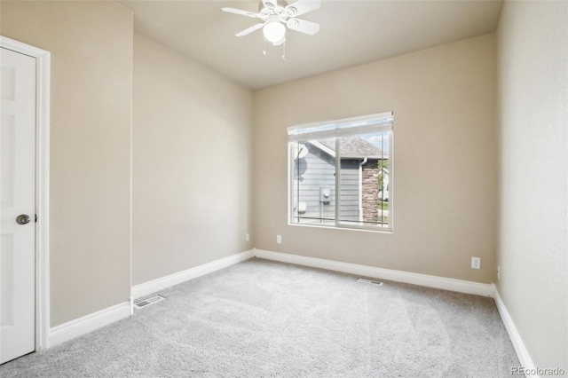 unfurnished room featuring carpet and ceiling fan