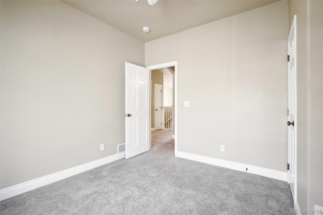 unfurnished bedroom featuring light colored carpet