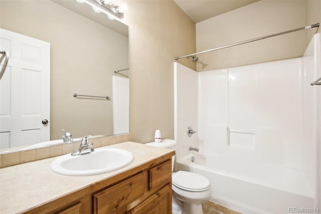 full bathroom featuring  shower combination, vanity, and toilet