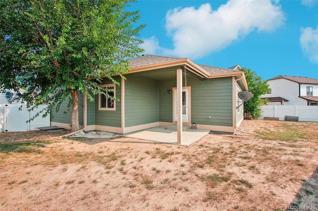 rear view of house with a patio