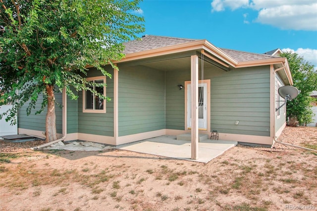 rear view of property featuring a patio