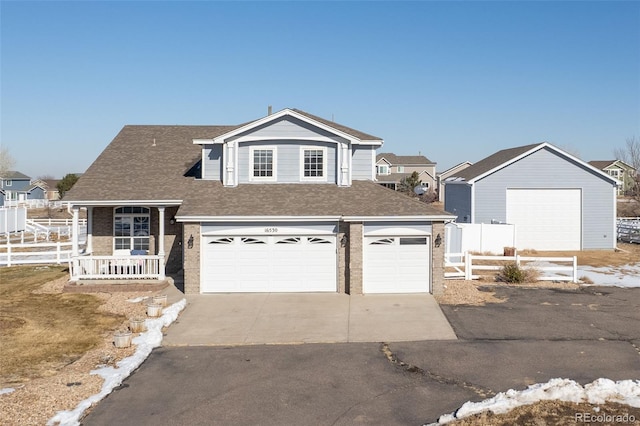 view of front of property with a garage and covered porch