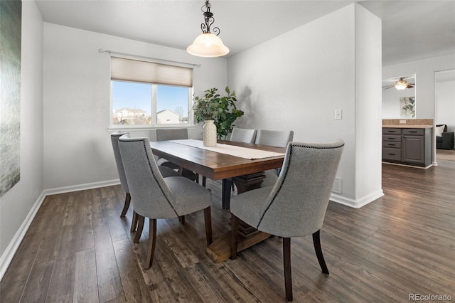 dining space featuring dark hardwood / wood-style floors