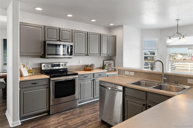 kitchen with sink, gray cabinets, and stainless steel appliances