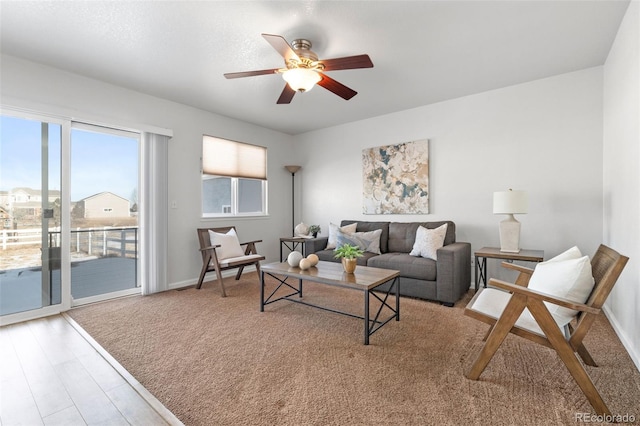 living room with hardwood / wood-style floors and ceiling fan