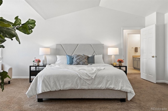 bedroom with lofted ceiling and light colored carpet