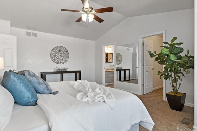 carpeted bedroom featuring ceiling fan, lofted ceiling, and ensuite bathroom