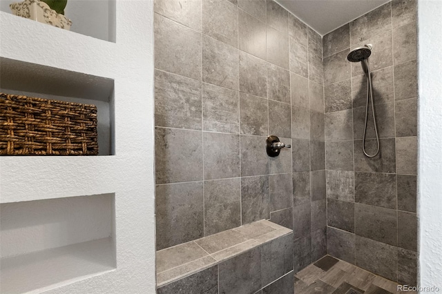 bathroom featuring tiled shower