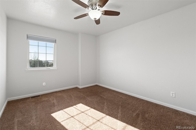 carpeted empty room with ceiling fan