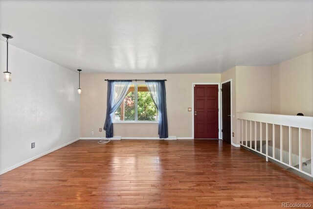 4627 S Norfolk Way, Aurora, CO 80015 - spare room featuring wood finished floors and baseboards