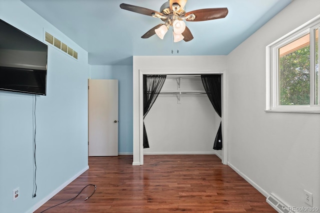 4627 S Norfolk Way, Aurora, CO 80015 - unfurnished bedroom featuring wood finished floors, a closet, and a ceiling fan