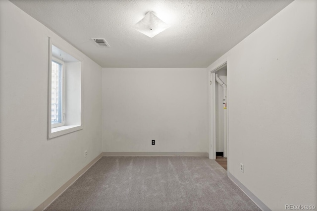 4627 S Norfolk Way, Aurora, CO 80015 - unfurnished room with light carpet and a textured ceiling
