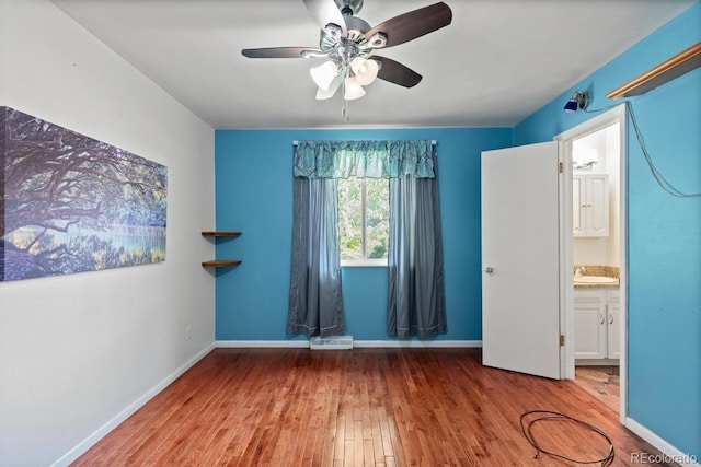 4627 S Norfolk Way, Aurora, CO 80015 - unfurnished bedroom with wood-type flooring and a ceiling fan