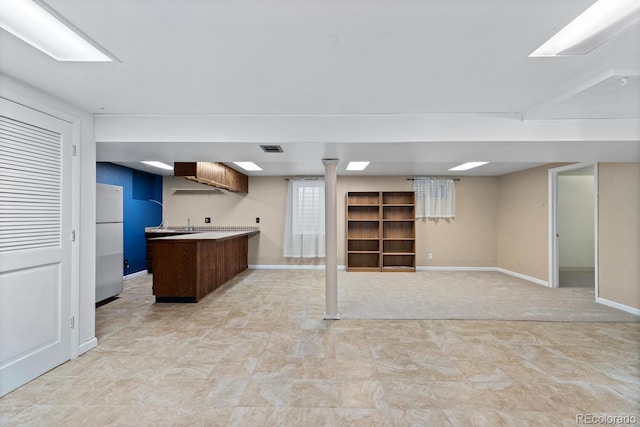 4627 S Norfolk Way, Aurora, CO 80015 - kitchen with freestanding refrigerator, open floor plan, and light countertops