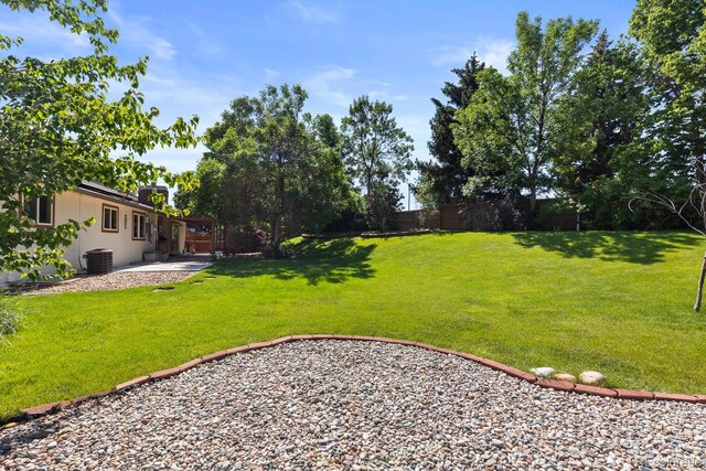 4627 S Norfolk Way, Aurora, CO 80015 - fenced backyard with a patio area