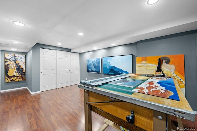 interior space with wood finished floors, baseboards, and recessed lighting