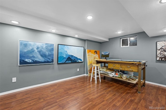 office featuring wood finished floors, baseboards, and recessed lighting