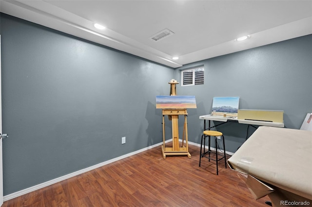 office featuring recessed lighting, baseboards, visible vents, and wood finished floors