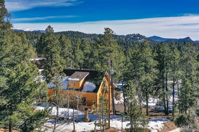 bird's eye view with a mountain view and a view of trees