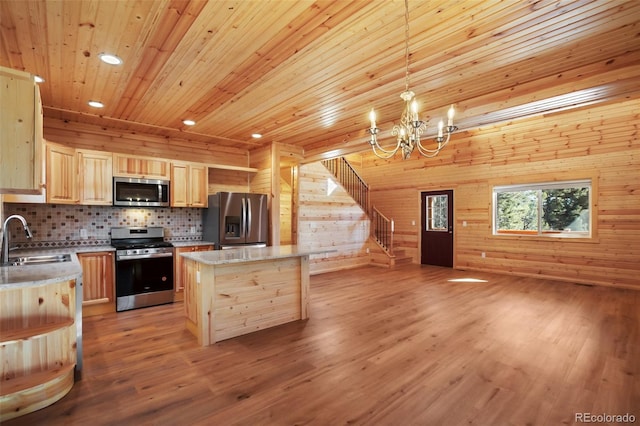 kitchen featuring light wood-style flooring, light brown cabinetry, a sink, stainless steel appliances, and wood ceiling