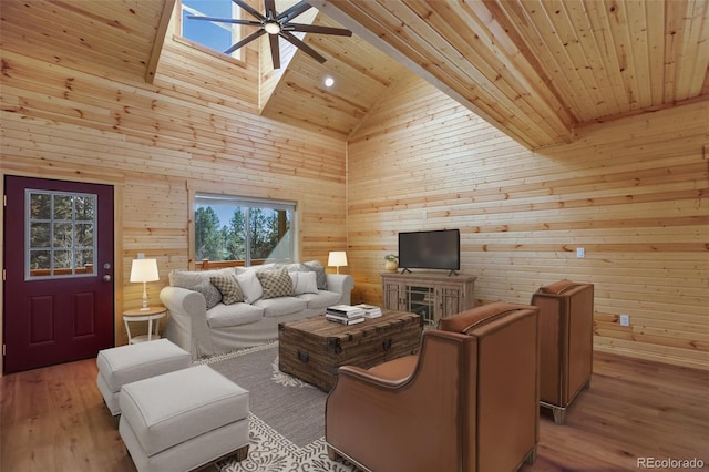 living room featuring wooden walls, high vaulted ceiling, ceiling fan, light wood-style floors, and wooden ceiling