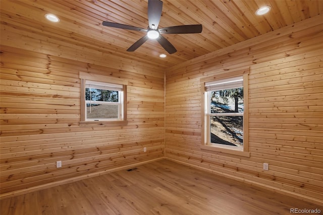 unfurnished room featuring a sauna, wooden ceiling, wood finished floors, and recessed lighting